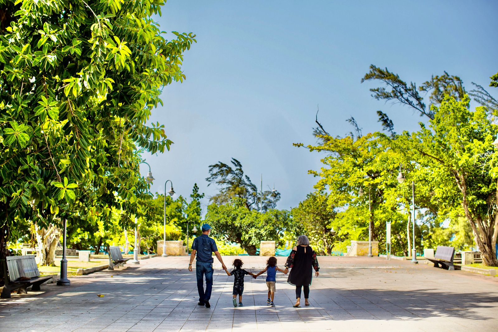 Family walking in a park after a Texas enforcement order