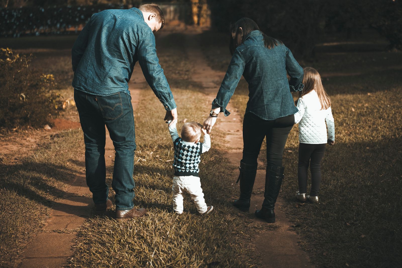 Parents and children holding hands after a Collin County custody order