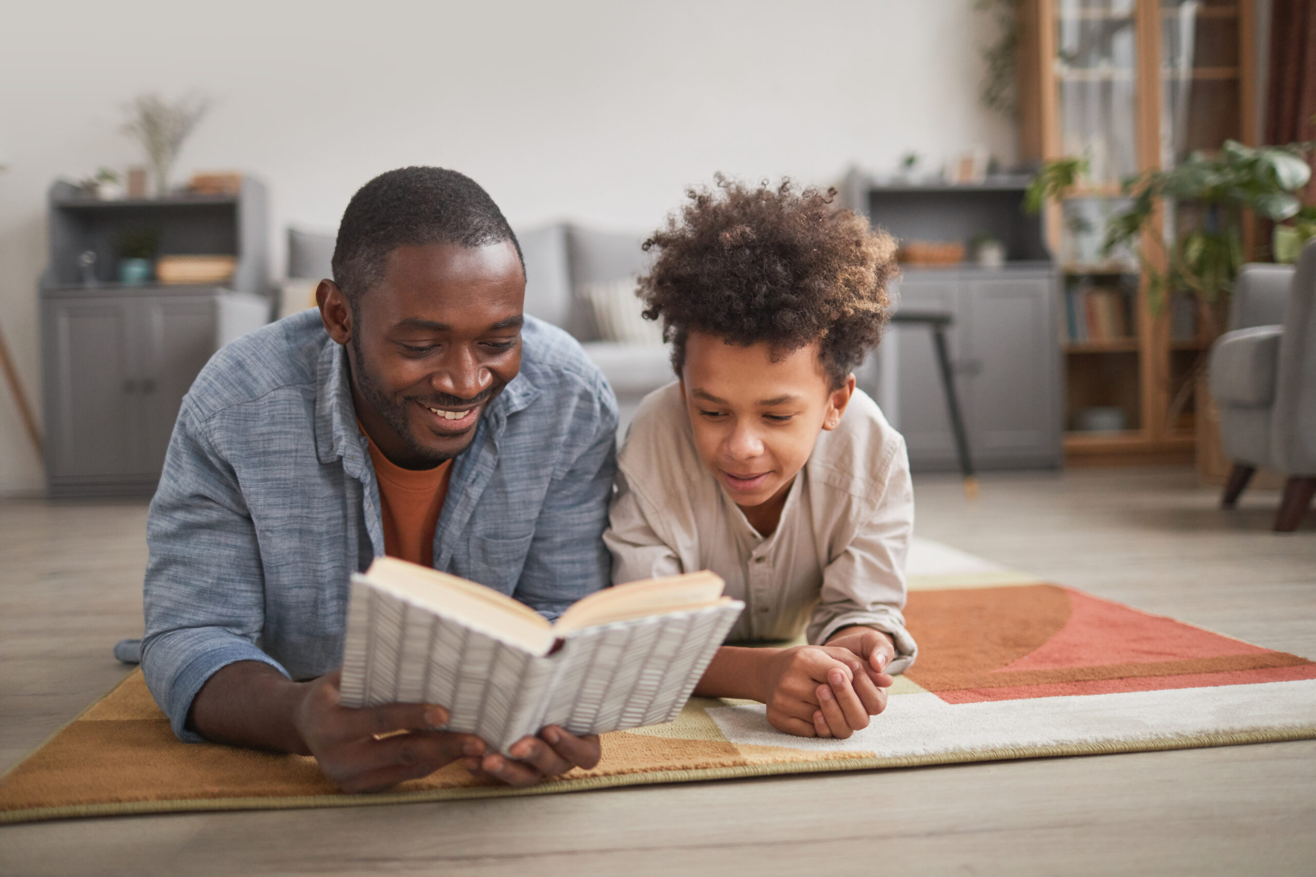 Father and young son reading together after a McKinney family law consultation