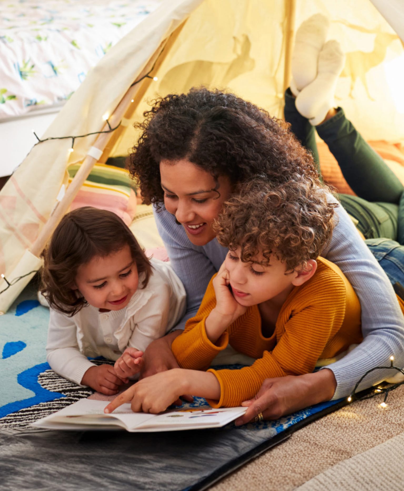 Mother reading with her children, McKinney family law client